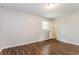 Bright bedroom with light walls, hardwood flooring, and a view to the yard at 4820 Oak Grove Dr, Cumming, GA 30040