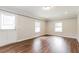 Spacious living area with hardwood floors, ample natural light, and neutral paint at 4820 Oak Grove Dr, Cumming, GA 30040