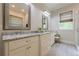 Bright bathroom with granite countertop, double vanity, soaking tub, and tile flooring at 124 White Oak Trl, Cumming, GA 30028