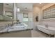 Luxury bathroom with granite countertop, double vanity, soaking tub, and tile flooring at 124 White Oak Trl, Cumming, GA 30028