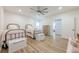 Charming bedroom featuring two beds with pink accents and wood-style flooring at 124 White Oak Trl, Cumming, GA 30028