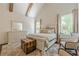 Bright primary bedroom with luxury decor and large windows overlooking wooded backyard at 124 White Oak Trl, Cumming, GA 30028