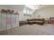 This bonus room has carpet and a ceiling fan at 124 White Oak Trl, Cumming, GA 30028