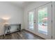 Hallway that leads to an outdoor pool and seating area at 124 White Oak Trl, Cumming, GA 30028