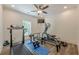 Dedicated home gym with treadmill and elliptical machine at 124 White Oak Trl, Cumming, GA 30028