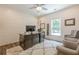 Comfortable home office with a large desk, chairs, and carpet at 124 White Oak Trl, Cumming, GA 30028
