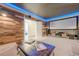 This home theater has a large screen, wood accent walls, and carpet at 124 White Oak Trl, Cumming, GA 30028
