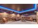 Relaxing home theater room with a large comfy leather couch and movie projector at 124 White Oak Trl, Cumming, GA 30028