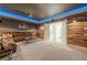 This home theater has a large screen, wood accent walls, carpet, and a ceiling fan at 124 White Oak Trl, Cumming, GA 30028