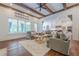 Spacious living room with exposed wood beams and an open layout to the kitchen at 124 White Oak Trl, Cumming, GA 30028