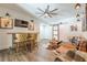 Living room with a bar, TV, unique decorations, and cozy seating at 124 White Oak Trl, Cumming, GA 30028