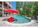 Beautiful in-ground pool features lounge chairs and lush greenery at 124 White Oak Trl, Cumming, GA 30028