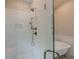 Glass shower with tiled seat features a dual shower head and white subway tile surround at 124 White Oak Trl, Cumming, GA 30028