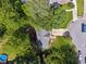A home nestled in a green neighborhood with mature trees and well-maintained landscaping as seen from above at 1679 Summit Place Way, Loganville, GA 30052