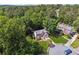Two-story home in a lush green neighborhood with mature trees and well-maintained lawns at 1679 Summit Place Way, Loganville, GA 30052