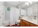 Cozy bathroom featuring a tub, shower, single sink vanity, and modern fixtures at 1679 Summit Place Way, Loganville, GA 30052