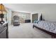 Bright bedroom with carpet and view of exercise equipment at 1679 Summit Place Way, Loganville, GA 30052