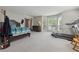 Spacious bedroom with carpet, large bay window, and exercise equipment at 1679 Summit Place Way, Loganville, GA 30052