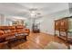 Open concept living room with hardwood floors flowing into an open kitchen area at 1679 Summit Place Way, Loganville, GA 30052