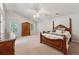 Comfortable main bedroom with ceiling fan and large windows for natural light at 1679 Summit Place Way, Loganville, GA 30052
