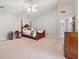Large main bedroom featuring carpet, high ceiling, and furniture at 1679 Summit Place Way, Loganville, GA 30052