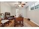 Bright office space featuring hardwood floors, a window, and a spacious desk with office chairs at 1679 Summit Place Way, Loganville, GA 30052