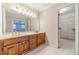 Bathroom features a double vanity, a large mirror with lighting, and a walk-in closet at 3510 Eagle Landing Dr, Snellville, GA 30039