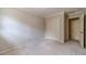 Carpeted bedroom featuring a double door closet and a doorway leading to another room at 3510 Eagle Landing Dr, Snellville, GA 30039