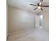A neutral walled bedroom includes a ceiling fan with a light fixture and carpet at 3510 Eagle Landing Dr, Snellville, GA 30039