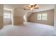 This bedroom has neutral walls, carpet, two windows, and angled ceilings at 3510 Eagle Landing Dr, Snellville, GA 30039