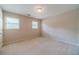 This bedroom features carpet and two windows that fill the room with natural light at 3510 Eagle Landing Dr, Snellville, GA 30039
