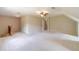 The carpeted bonus room has neutral walls, multiple windows, and a ceiling fan at 3510 Eagle Landing Dr, Snellville, GA 30039