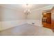 Dining room featuring hardwood floors, detailed molding, and a chandelier at 3510 Eagle Landing Dr, Snellville, GA 30039