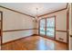 Dining room with hardwood floors, natural light from a large window and wood trim at 3510 Eagle Landing Dr, Snellville, GA 30039