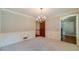 Dining room features neutral walls, chair railing, crown molding, and plush carpeting at 3510 Eagle Landing Dr, Snellville, GA 30039