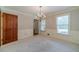 Bright dining room features neutral walls, chair railing, crown molding, and a chandelier at 3510 Eagle Landing Dr, Snellville, GA 30039