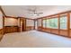 Spacious living room with a wet bar, large windows, and stylish wood trim throughout at 3510 Eagle Landing Dr, Snellville, GA 30039