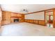 Bright living room with brick fireplace, built-in shelving, and view into entry hall at 3510 Eagle Landing Dr, Snellville, GA 30039