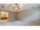 Spacious main bedroom with a vaulted ceiling, fan, ensuite bathroom and neutral color palette at 3510 Eagle Landing Dr, Snellville, GA 30039