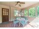 Inviting screened porch with outdoor furniture and views of the surrounding greenery at 3510 Eagle Landing Dr, Snellville, GA 30039