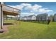 A beautiful, expansive backyard with lush green grass and a classic black fence at 784 Keystone Dr, Woodstock, GA 30188