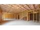 Unfinished basement showcasing framing, insulation, and ample space at 784 Keystone Dr, Woodstock, GA 30188