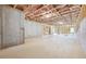 Unfinished basement showcasing framing, insulation, and ample space at 784 Keystone Dr, Woodstock, GA 30188