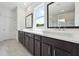Bathroom featuring double vanity, modern fixtures, and a large window for natural light at 784 Keystone Dr, Woodstock, GA 30188