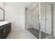 Bright bathroom with large glass enclosed shower, stylish fixtures, and tile flooring at 784 Keystone Dr, Woodstock, GA 30188