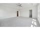 Spacious bedroom with tray ceiling, carpet, and ample natural light at 784 Keystone Dr, Woodstock, GA 30188