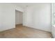 Bright, sunny room with hardwood floors and a large window offer natural light at 784 Keystone Dr, Woodstock, GA 30188