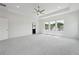 Spacious bedroom with tray ceiling, carpet, and ample natural light at 784 Keystone Dr, Woodstock, GA 30188
