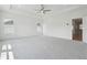 Spacious bedroom with tray ceiling, carpet, and ample natural light at 784 Keystone Dr, Woodstock, GA 30188