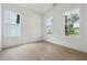 Bright, sunny room with hardwood floors and two large windows offer natural light at 784 Keystone Dr, Woodstock, GA 30188